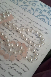 Laurie's Keepsake Items: Pink and White pearl-type 1920's-themed necklaces.