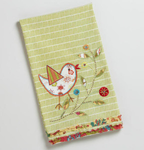 Georgie's keepsake item: applique tea towel, from the heroine who finds joy in sewing. 